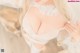 A woman wearing a white lingerie and stockings.